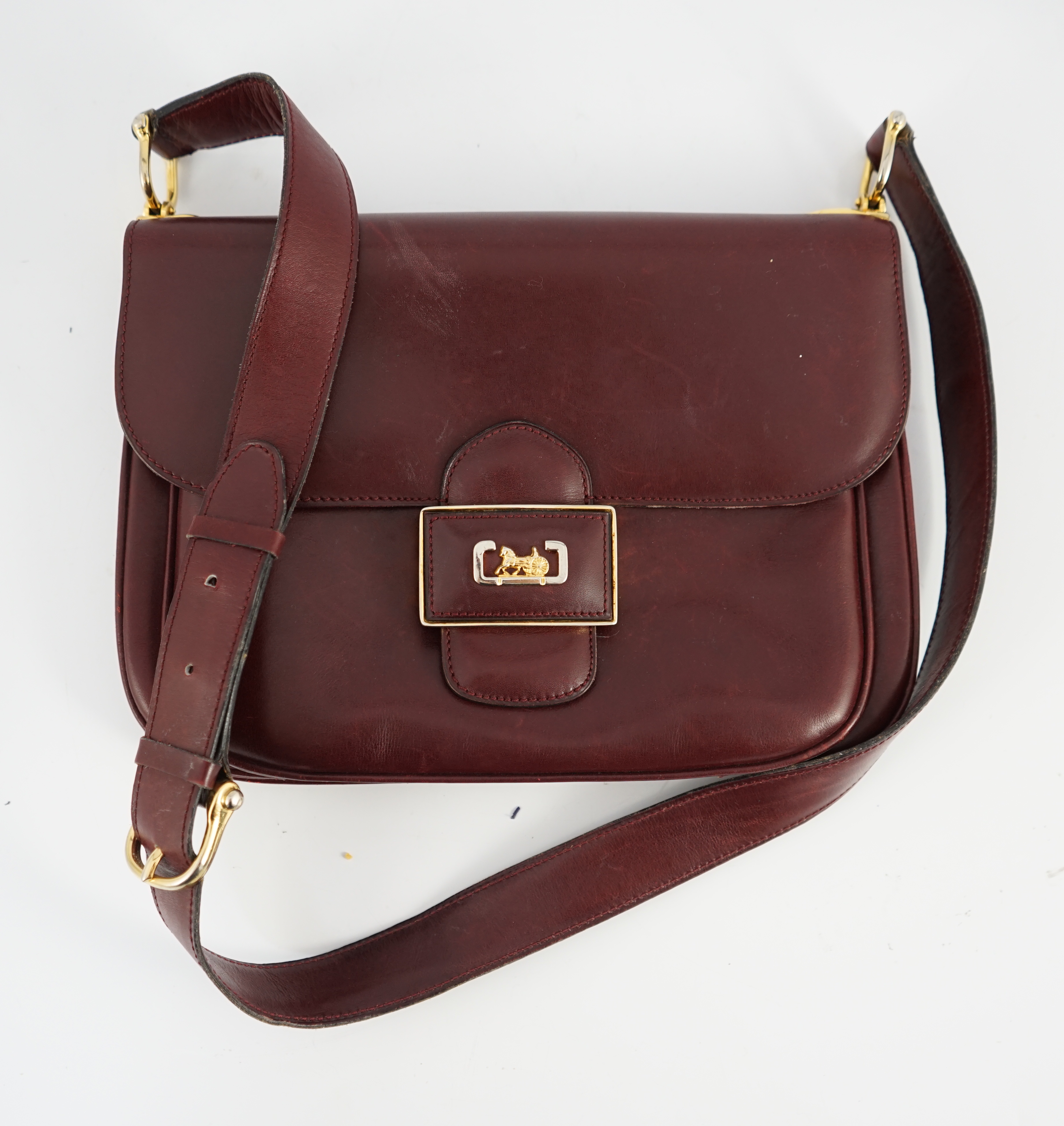 A vintage Celine horse carriage cargo flap burgundy leather shoulder bag, width 26cm, depth 3cm, height 18.5cm